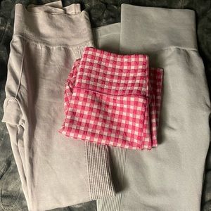 Bundle with 2 pairs of grayish colored leggings and 1 checkered pink biker short